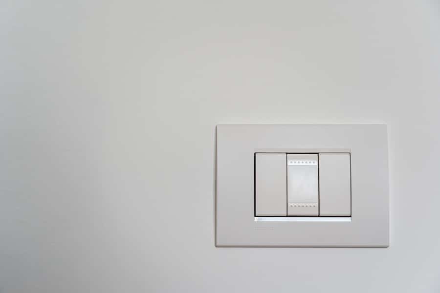 Electrician in Port Salerno Florida Close Up of a Three Switch Light Switch Panel