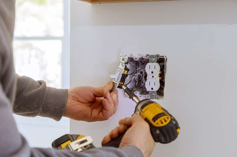 Best High End Electrical Contractor in Palm Beach Work on installing electrical outlets.