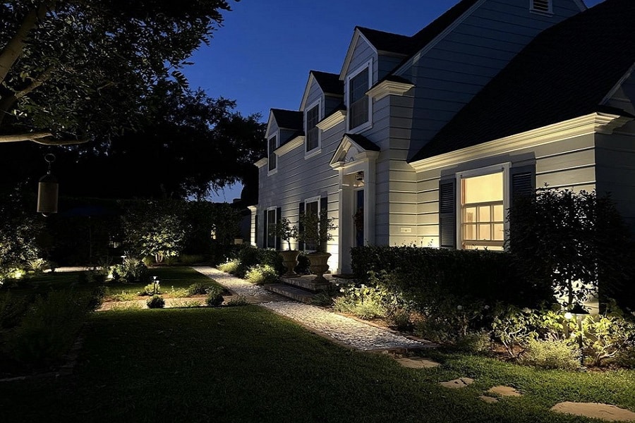 Professional Landscape Lighting Electrician Angle View of a Home at Night with Outdoor Lighting