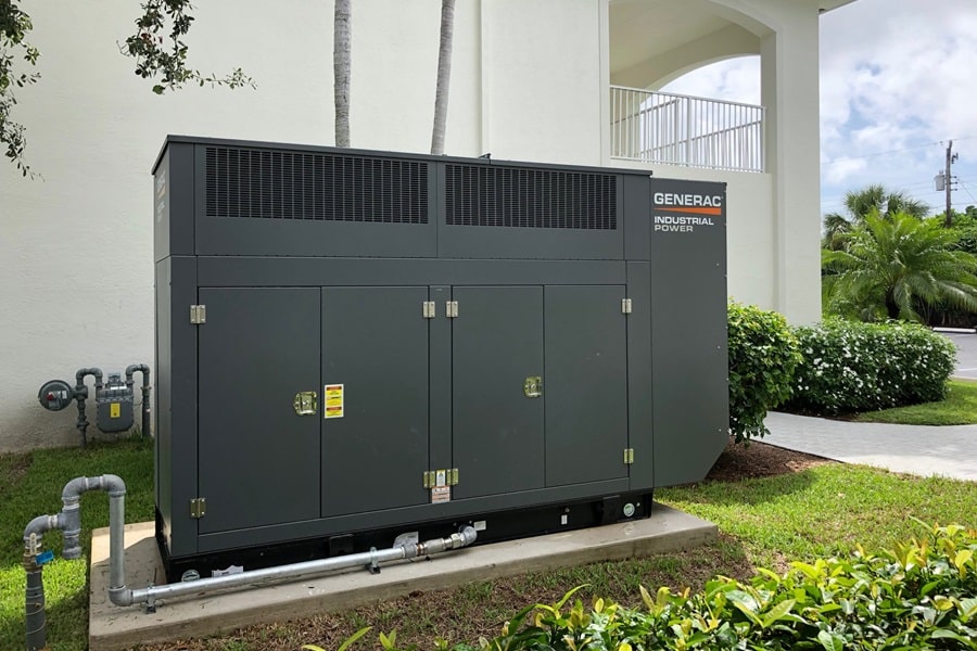 Certified Generac Service Provider in Palm Beach County Florida a Standby Generac Generator Outside of a Building