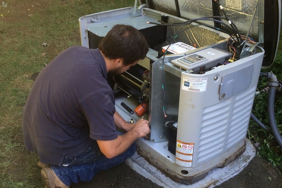 Certified Generac Service Provider in Palm Beach County Florida an Electrician Working on a Generac Generator