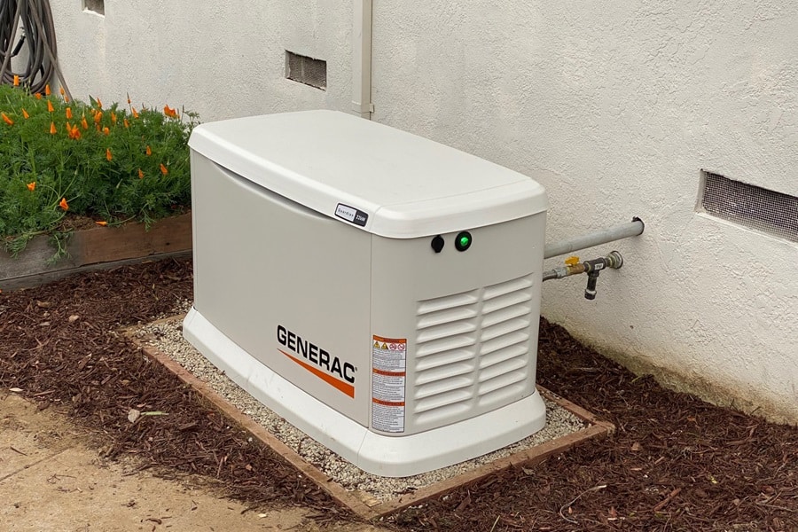 Certified Generac Service Provider in Palm Beach County Florida a Small Generac Generator Outside of a House