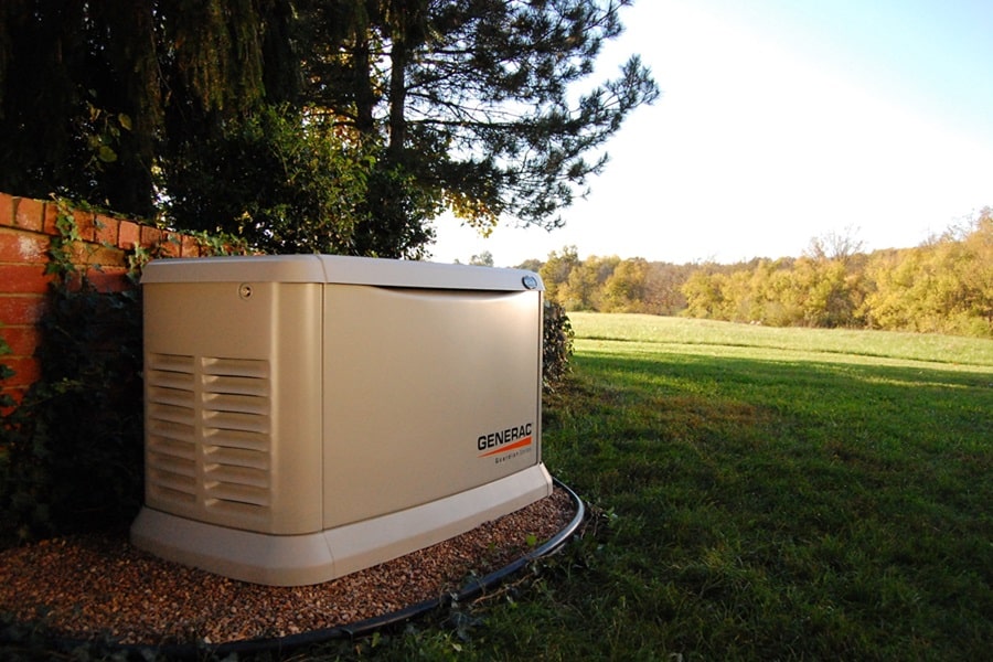 Martin County Generac Service Provider Electrician a Generac Generator Outside with Trees and a Field in the Background
