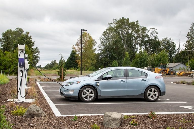 Best EV Charger Installation Electrician in Hobe Sound Florida an EV Charging in a Public Parking Lot