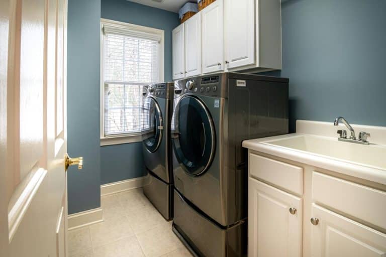 Best Home Surge Protection Electrician in West Palm Beach a Washing and Drying Machine in a Laundry Room of a Home