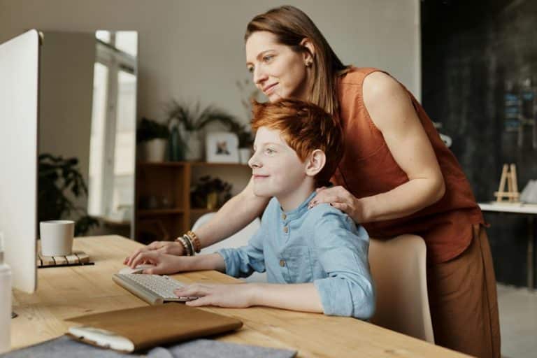 Best Home Surge Protection Electrician in Lake Worth a Mother and Son Working Together on a Desktop Computer at Home