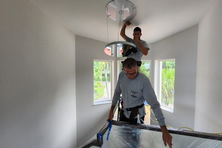 Best Electrician Near Me West Palm Beach Two Electricians Installing a Chandelier