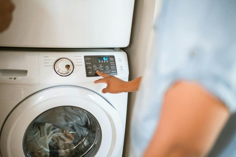 Best Home Surge Protection Electrician in Palm Beach Gardens a Person Turning on a Washing Machine