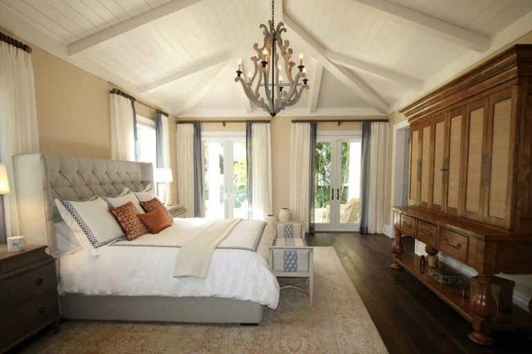 Best Chandelier Installation Electrician in West Palm Beach a Chandelier Hanging Over a Bed in a Bedroom