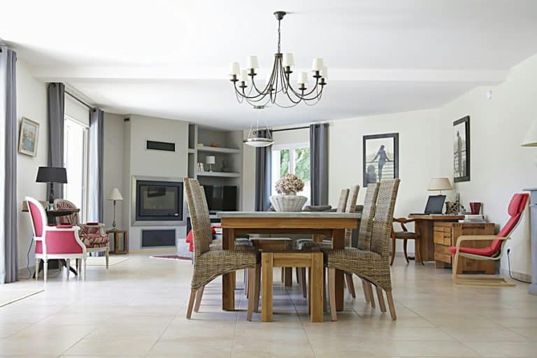 Best Chandelier Installation Electrician in Boca Raton a Dining Room with a Table and a Chandelier Hanging Above it