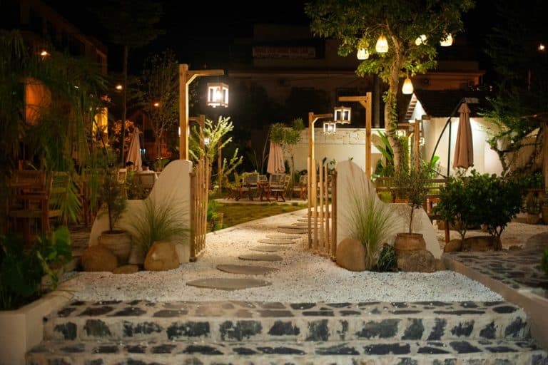 Best Exterior Landscape Lighting Electrician in West Palm Beach View of a Professionally Landscaped Yard with Landscape Lighting