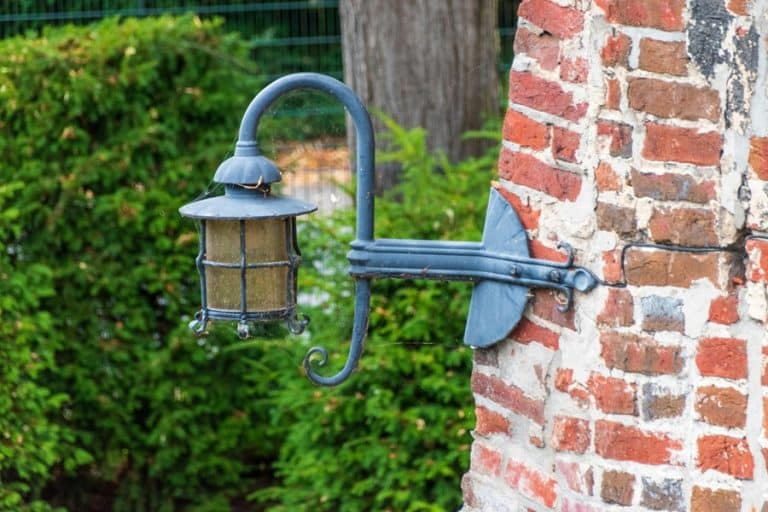 Best Exterior Lighting Electrician in Boca Raton Close Up of a Wall Light on a Brick Wall Outside