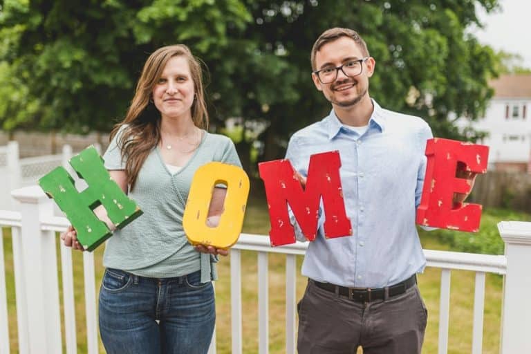 Best HOA Community Electrician in Boca Raton a Man and a Woman Holding Wooden Letters That Spell Out Home