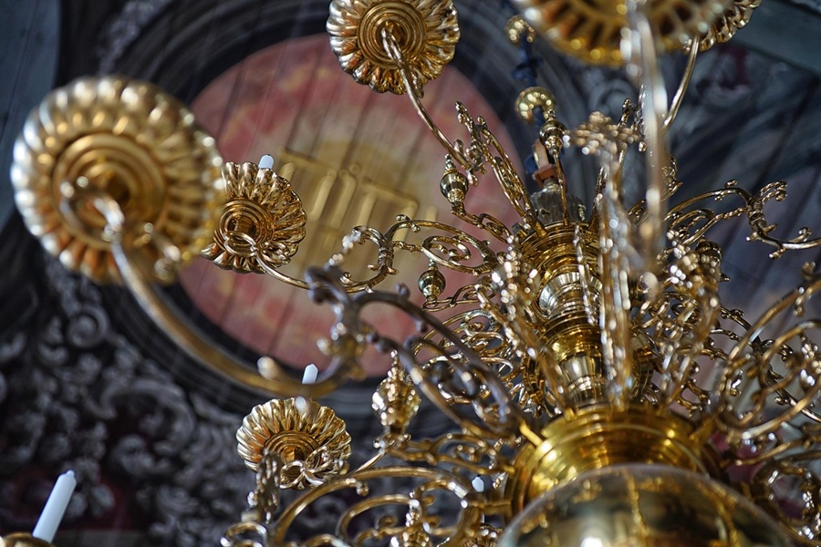 Best Chandelier Installation Electrician in Royal Palm Beach Close Up of a Metal Chandelier's Arm