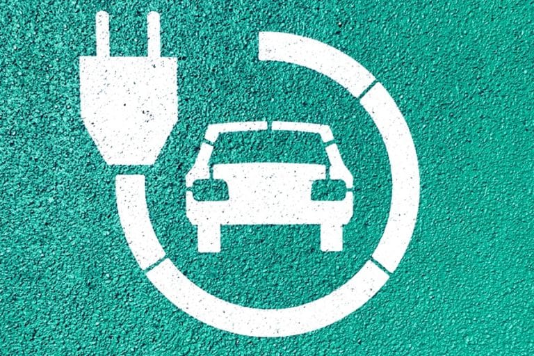 Best EV Charger Installation Electrician in Equestrian Club Estates Wellington An EV Charging Sign with a Plug Circled Around a Car