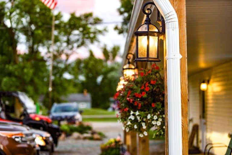 Best Landscape Lighting Electrician in Equestrian Club Estates Close Up of Outdoor Lighting on a Home with Cars in a Driveway
