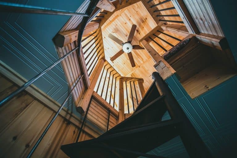 Best Ceiling Fan Installation Electrician in Royal Palm Beach a Ceiling Fan View from Below with a Stairway That Winds Upward Toward the Ceiling Fan