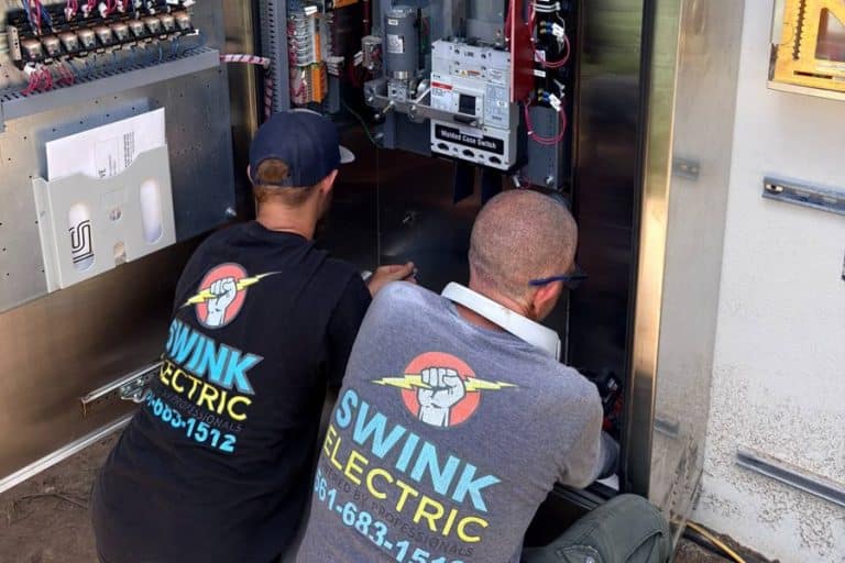 Best Electrical Panel Upgrade Electrician in Stuart Florida Two Electricians Working on an Electrical Panel