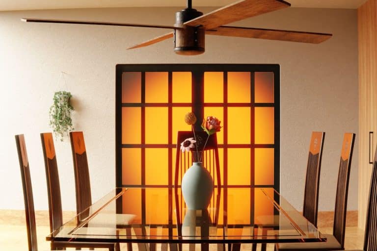 Best Ceiling Fan Installation Electrician in Stuart Florida a Ceiling Fan Above a Dining Table with a Flower Centerpiece