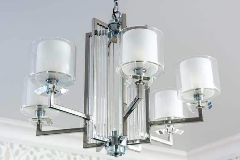 Best Chandelier Installation Electrician in Manalapan Florida a Modern Metallic Chandelier Hanging in a White Room