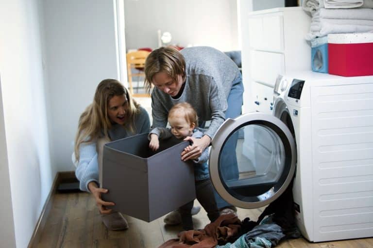 Best Laundry Room Remodel Electrician in Stuart a Mother, Father and Child Doing Laundry Together in a Laundry Room