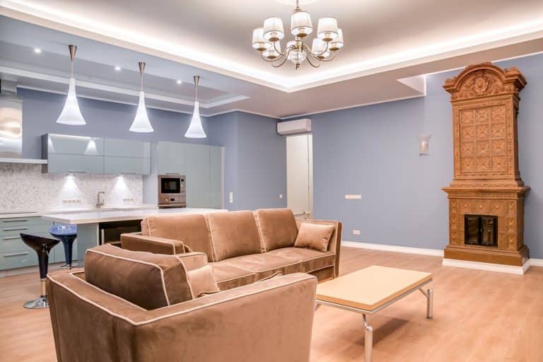 Best Electrician in Manalapan Florida a Living Room with a Chandelier and Pendant Lights in the Background Kitchen