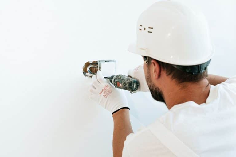 Best Home Remodel Electrician in Jupiter an Electrician Installing an Outlet