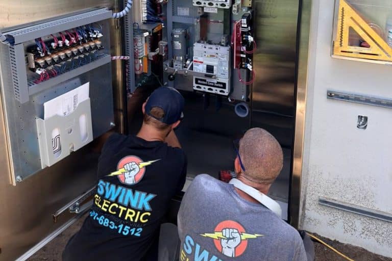 Electrician Jobs in Greenacres Florida Two Swink Electricians Working on an Electrical Panel