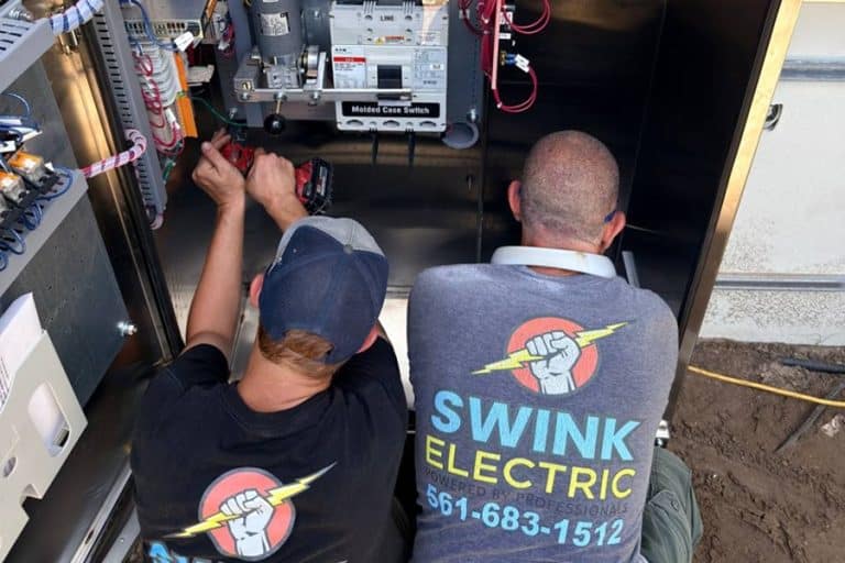 Electrician Jobs in Lake Worth Beach FL Two Electricians Working on a Panel
